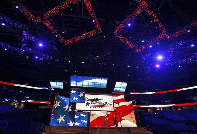 Republican National Committee Chairman Reince Priebus, left, and convention CEO William Harris unveil the stage and podium for the 2012 Republican National Convention last week. (AP/Scott Iskowitz)