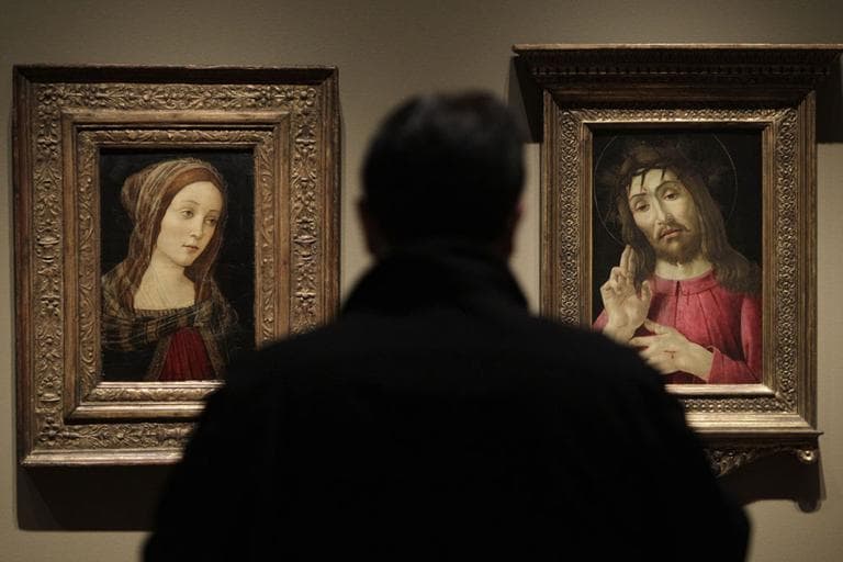 In an exhibition on forgeries at the Detroit Institute of Arts, a painting titled "A Female Saint", left, that once was attributed to Italian artist Sandro Botticelli is exhibited alongside "The Resurrected Christ," right, a Botticelli painting from around 1480. (AP)