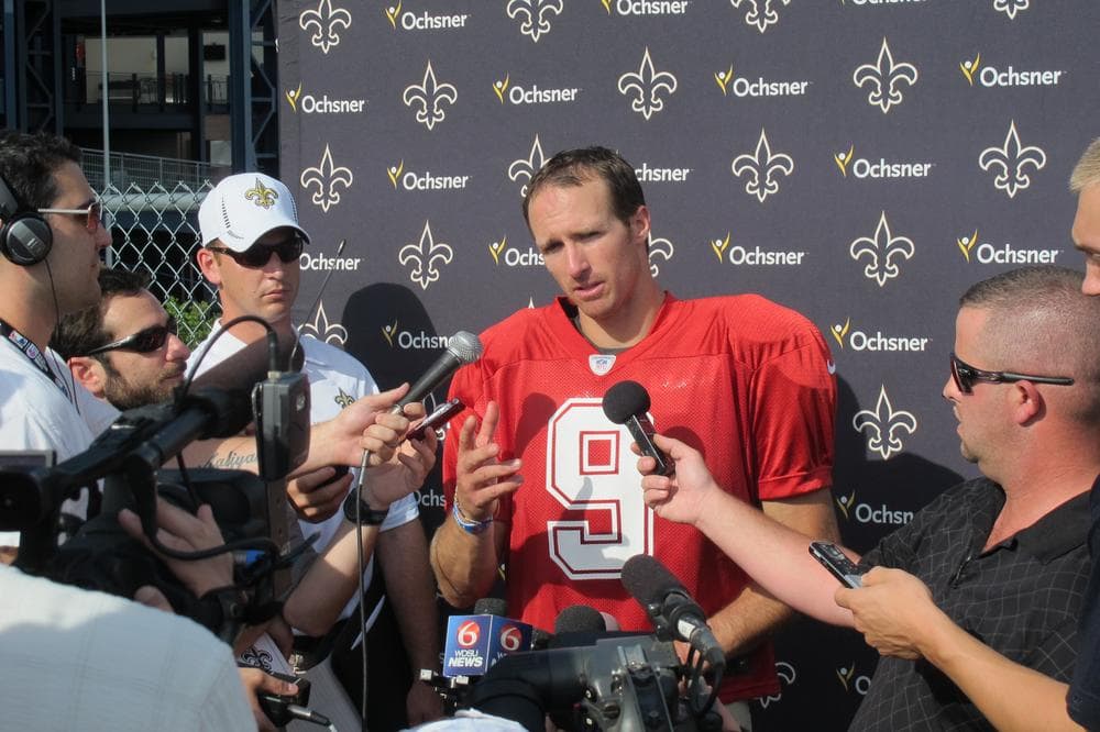 Saints quarterback Drew Brees speaks with members of the media. (Doug Tribou/WBUR)