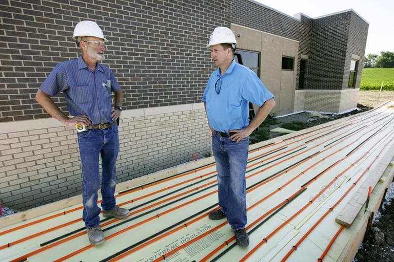 In this Tuesday, June 19, 2012 photo, electrical contractor Howie Drees talks with foreman Don Irlbeck, left, on a job site in Carroll, Iowa. "I would say Obama and his staff stepped up and made some tough decisions and put some money out there and kept things moving," says Drees, who says up half the projects he's worked on in recent years involved federal funds. "I was happy to see someone actually try to stimulate the economy with low interest rates, instead of waiting until more damage was done." (AP)