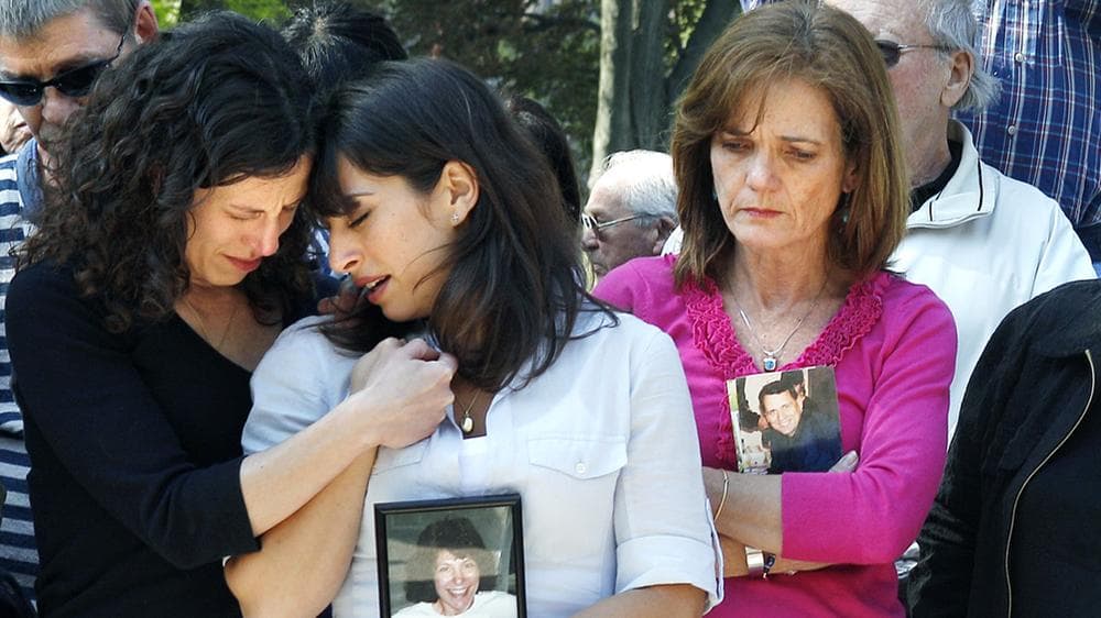 This day is always painful for victims’ families – but, says Carie Lemack, it’s also a time to remember our common goals. In this photo, Lemack, center, and her sister Danielle Lemack, left, observe a moment of silence at the Garden of Remembrance, a memorial dedicated to the 206 Massachusetts victims of September 11, 2001. Also pictured, Christie Coombs, right, who lost her husband Jeff Coombs in the 9/11 terrorist attacks. (AP File Photo)