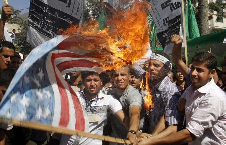 Palestinian Hamas supporters burn a U.S. flag during a protest in Gaza City, Friday, as part of widespread anger across the Muslim world about a film ridiculing Islam's Prophet Muhammad. (AP)