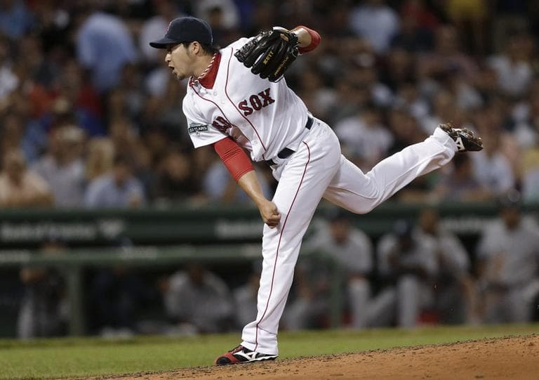 Red Sox pitcher Junichi Tazawa watches a delivery to the New York Yankees during the seventh inning on Thursday. (AP/Charles Krupa)
