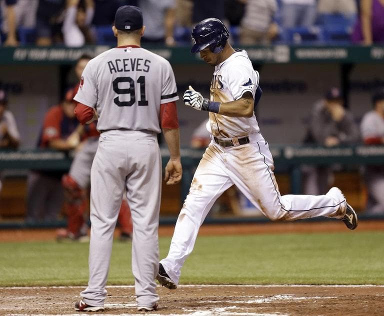 Tampa Bay Rays' Desmond Jennings scores past Red Sox relief pitcher Alfredo Aceves on Wednesday in St. Petersburg, Fla. (AP/Chris O'Meara)