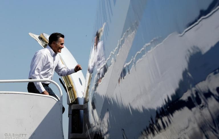 Republican presidential candidate and former Massachusetts Gov. Mitt Romney boards his campaign plane in Los Angeles on Sunday (Charles Dharapak/AP)