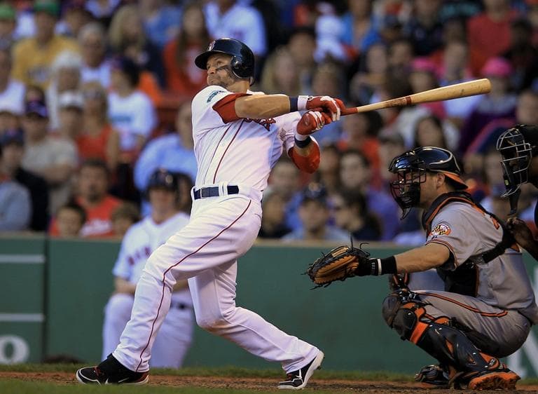 Red Sox's Cody Ross hits an RBI double off a pitch by Baltimore Orioles' Luis Ayala allowing Red Sox's Dustin Pedroia to score in the eighth inning. (AP/Steven Senne)