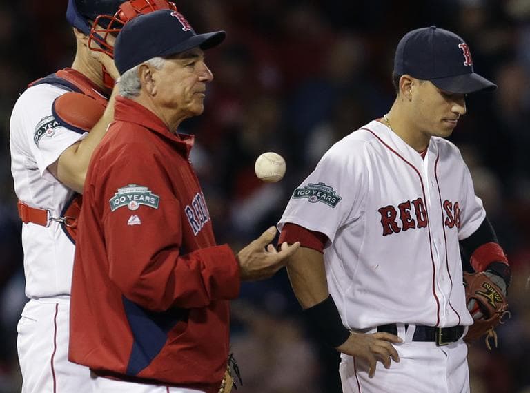 Boston Red Sox manager Bobby Valentine, shortstop Jose Iglesias, right, and catcher Ryan Lavarnway wait on the mound for relief pitcher Andrew Miller in the eighth inning against the Rays Tuesday night. (AP)