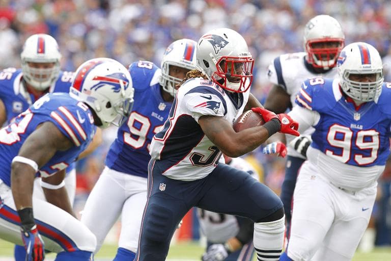New England Patriots' Brandon Bolden runs under pressure from the Buffalo Bills during the second half Sunday, Sept. 30, 2012. (AP)