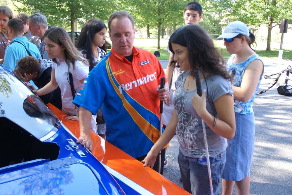 Jay Blake talks with a student at the Carroll Center for the Blind in Newton, Mass.  Ironically, Blake's father served on the center’s board years before Jay lost his sight. (Courtesy of the Carroll Center)