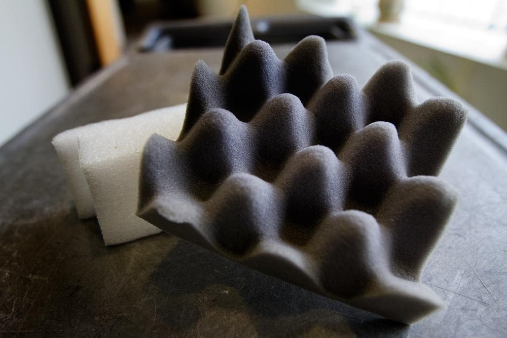 Samples of the soundproofing foam that was a contributing factor to the Station night club fire. Top: egg-crate polyurethane (PU) foam. Bottom: polyethylene (PE) foam. (Jesse Costa/Here &amp; Now)