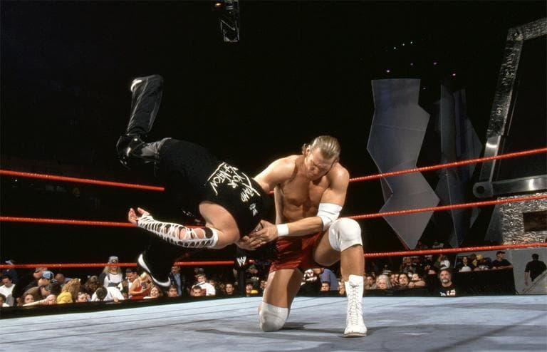 Chris Nowinski, right, used to get hit in the head for a living. Now his passion is preventing concussions in sports. (Courtesy of WWE)
