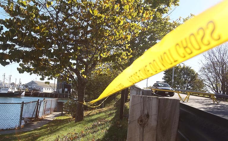 Local police block off the bridge leading to Peirce Island in Portsmouth, N.H., where officials search for a body Saturday. (Cheryl Senter/AP)