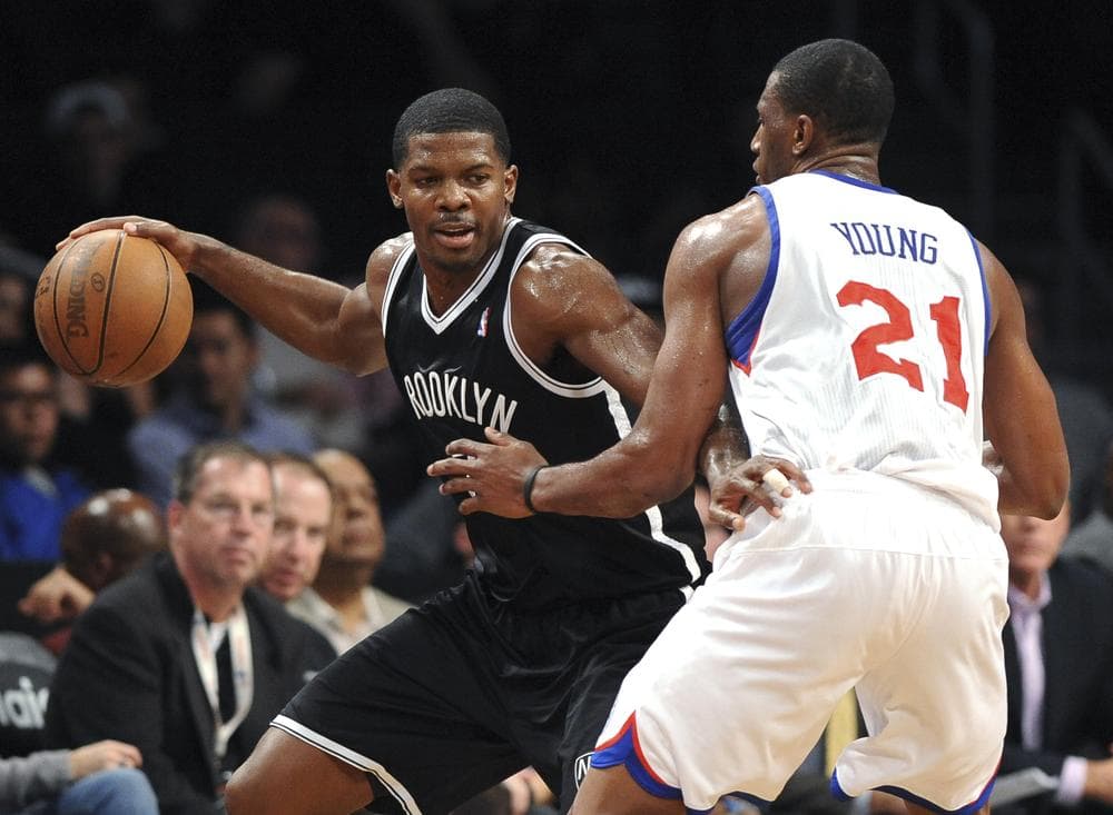The Brooklyn Nets play the Philadelphia 76ers in an NBA preseason game in New York. The Nets open regular season in their new home on Nov. 1, against the New York Knicks. (AP/Kathy Kmonicek)