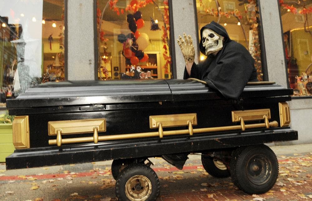 Frank Major, of Chicopee, Mass., dressed as the grim reaper rides in a motorized coffin days before Halloween, Oct. 27, 2009 in Salem, Mass. (AP)