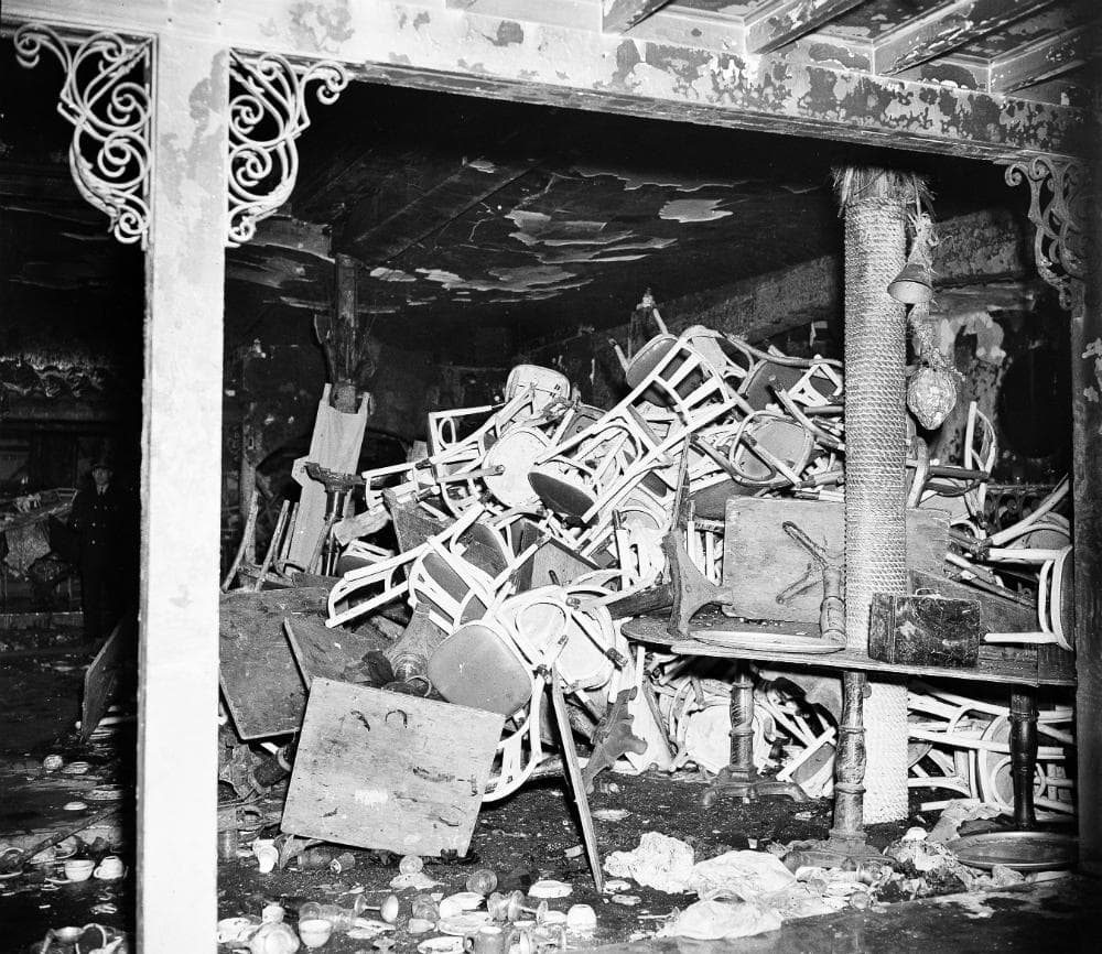 Chairs are piled up inside the charred Cocoanut Grove night club. (AP)