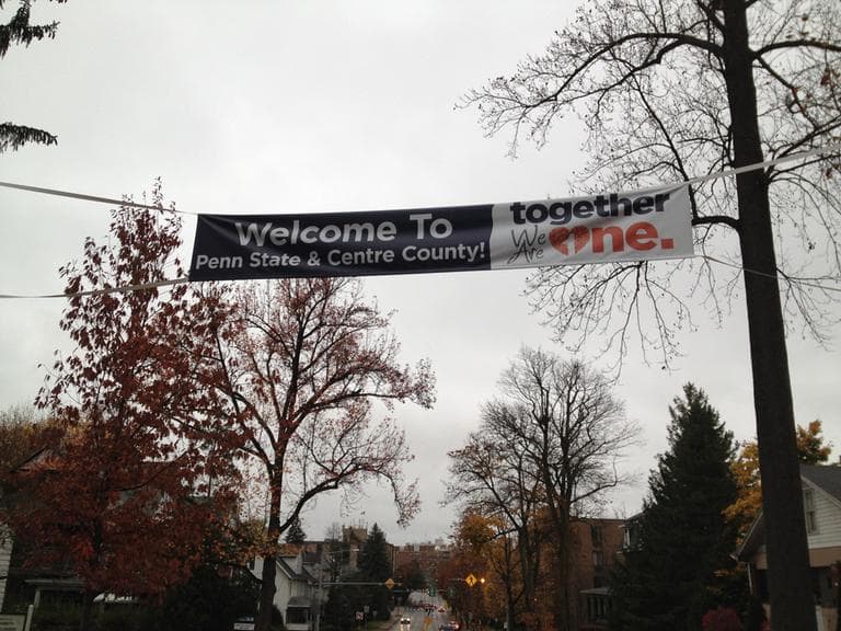 A banner stretched over Atherton Street by the local chamber of commerce, proclaiming a message of unity. (Adam Ragusea/Georgia Public Broadcasting)