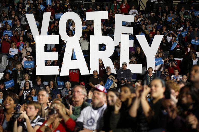 A "Vote Early" sign is displayed at an Obama campaign rally Oct. 29 in Ohio. (Matt Rourke/AP)