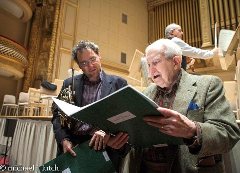 Elliott Carter reviews his composition, "Horn Concerto" with Boston Symphony Orchestra principal horn player James Sommerville during a rehearsal at Symphony Hall Boston. (Michael Lutch/H&N listener)