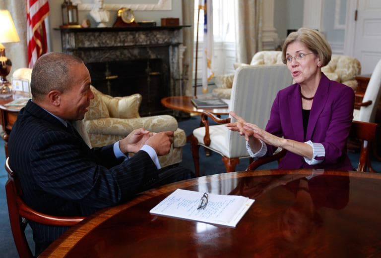U.S. Sen.-elect Elizabeth Warren speaks with Gov. Deval Patrick in the governor's office at the State House on Thursday (Steven Senne/AP)