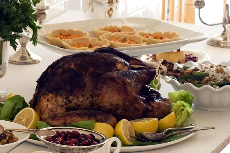 This image taken on October 22, 2012 shows a detail of a gourmet Thanksgiving dinner with porcini soy turkey, asparagus and haricots verts with goat cheese and pine nuts and lemon-herb carrot tarts served on a table in Concord, N.H. (AP)