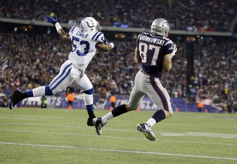 Patriots tight end Rob Gronkowski (87) hauls in a touchdown pass as Indianapolis Colts inside linebacker Kavell Conner (53) defends on Sunday. (AP/Michael Dwyer)