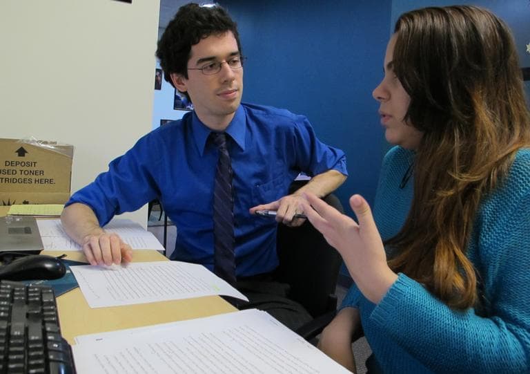 Emily Soto works on her college applications with Joe Maurer, a counselor at Bottom Line, a nonprofit that helps disadvantaged students get into college. (Monica Brady-Myerov/WBUR)