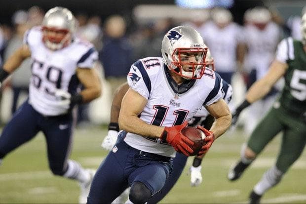 The Patriots' Julian Edelman returns a fumble for a touchdown during the first half of Thursday's game against the Jets. (Bill Kostroun/AP)