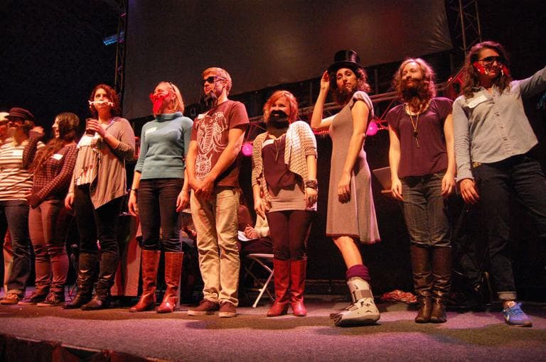 Fake beard contestants stand on stage. (Greg Cook)
