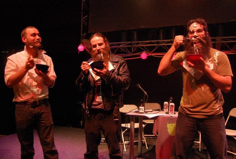 Bert Mayer (from left) and Dave Lehr were defeated by Jon Leonard in the chowder eating contest. (Greg Cook)
