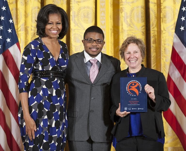 First Lady Michelle Obama celebrates awarding the National Arts and Humanities Youth Program prize to Boston's ICA with ICA Teen Arts Council member Romario Accime (center) and ICA director Jill Medvedow. (Photo: Steven E. Purcell)