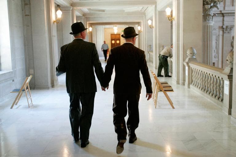 In this 2008 file photo, Curt Garman, left, and Richard Looke hold hands as they look for a quiet spot to hold their wedding at City Hall in San Francisco. The U.S. Supreme Court decided Friday to hear the appeal of a ruling that struck down Proposition 8, the state’s measure that banned same sex marriages. (Marcio Jose Sanchez/AP)