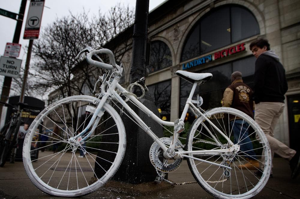A memorial "ghost bike" is seen on the corner of Commonwealth Avenue and St. Paul Street, where cyclist Christopher Weigl, 23, died on Thursday. (Jesse Costa/WBUR)