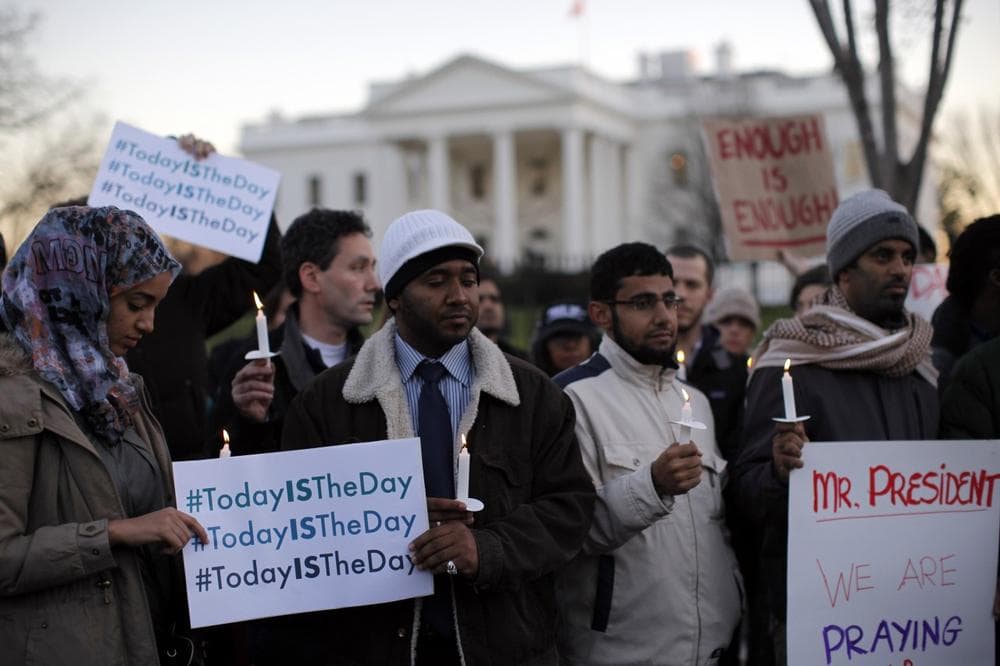 Supporters of gun control gather on Pennsylvania Avenue in front of the White House in Washington, Friday, Dec. 14, 2012, during a vigil for the victims of the shooting at Sandy Hook Elementary School in Newtown, Ct., and to call on President Obama to pass strong gun control laws. (AP)