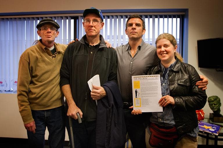 From left, Pilgrim contributors David "Shaggy" Hurley and Kevin Walker, Pilgrim editor James Parker and Pilgrim contributor Margaret Miranda, holding a copy of the literary magazine. (Jesse Costa/WBUR)