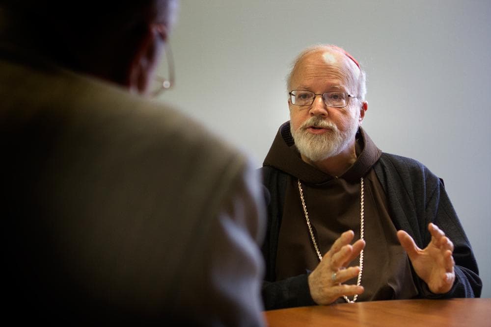 In this file photo, Cardinal Sean O'Malley speaks with WBUR's Bob Oakes at archdiocese offices in Braintree. (Jesse Costa/WBUR)