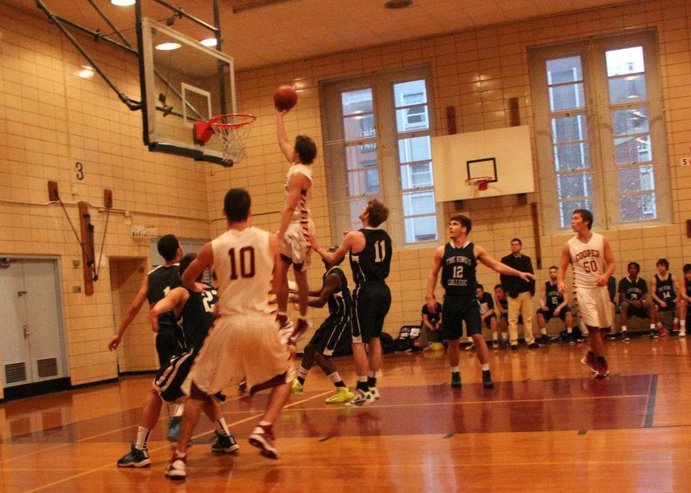 The starting five of the Cooper Union men's basketball team (in white) all have at least a 3.9 GPA. (Photo courtesy Joanna Cruz/Cooper Union)