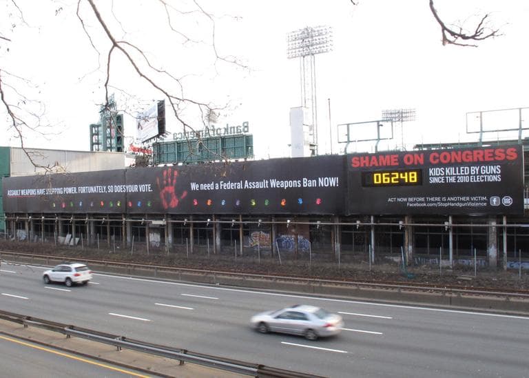 The 20 small handprints on the Stop Handgun Violence billboard represent the children killed at Sandy Hook Elementary School in Newtown, Conn. (Lynn Jolicoeur/WBUR)
