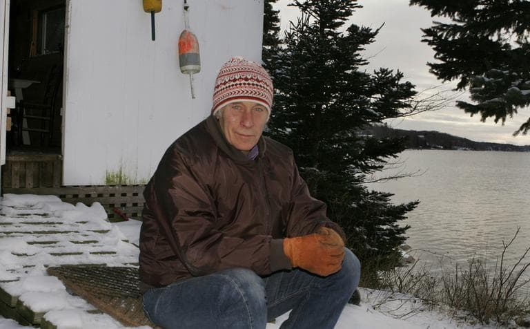 Author Richard Ford sits outside his boat house by Linekin Bay near his house in East Boothbay, Maine, in 2007. (Pat Wellenbach/AP)