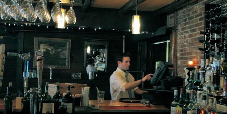 Sam Mackin has an undergraduate degree in journalism, but now works at a restaurant in Shirley, Mass. (Nate Goldman/WBUR)