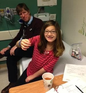 Riley Cerabona celebrates her last dose of nasty-tasting medicine. (Jesse Costa/WBUR)