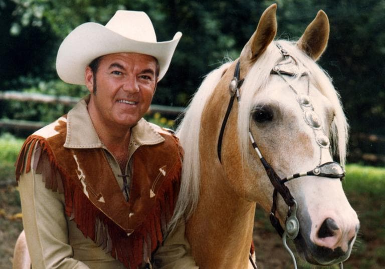 In this 1972 photo provided by Rex Trailer Productions & Digital Freeway, Rex Trailer poses with his horse in Boston. (Peter Benjamin/AP)