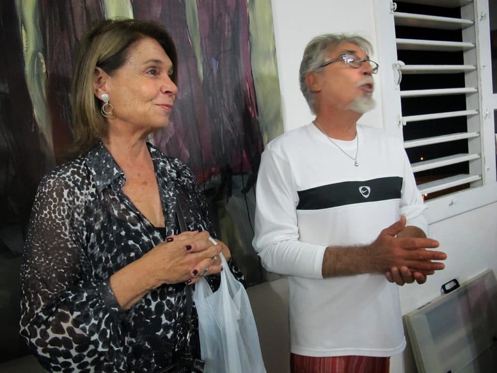 Cuban-American Silvia Wilhelm, who holds a license to organize people-to-people tours, with artist Edel Bordon (Andrea Shea/WBUR)
