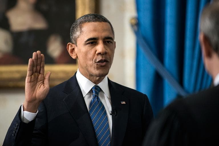 President Barack Obama is officially sworn-in by Chief Justice John Roberts in the Blue Room of the White House during the 57th Presidential Inauguration in Washington, Sunday, Jan. 20, 2013. (AP Photo/Brendan Smialowski, Pool)