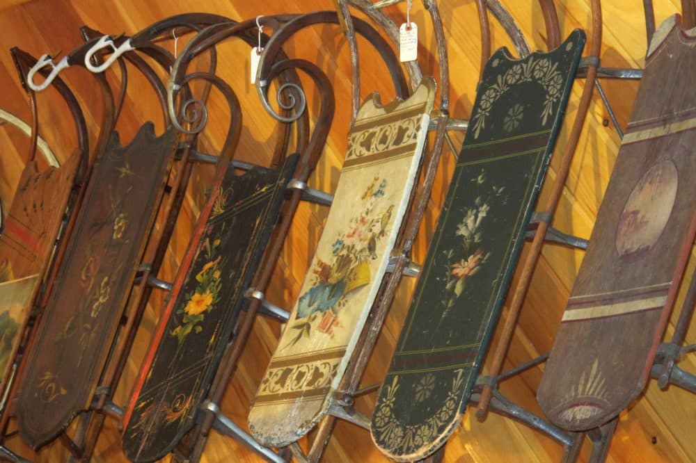 These sleds were made by Paris Manufacturing in the 1800s. Hand-painted sleds like these originally sold for $5 a piece wholesale. Today some are worth several thousand dollars. (Doug Tribou/Only A Game)