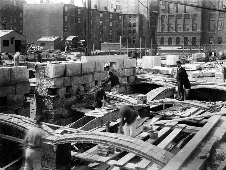 Rafael Guastavino Sr. (right) stands atop on a newly erected arch as the Boston Public Library's McKim Building was being constructed in 1889. (Courtesy of the Boston Public Library)