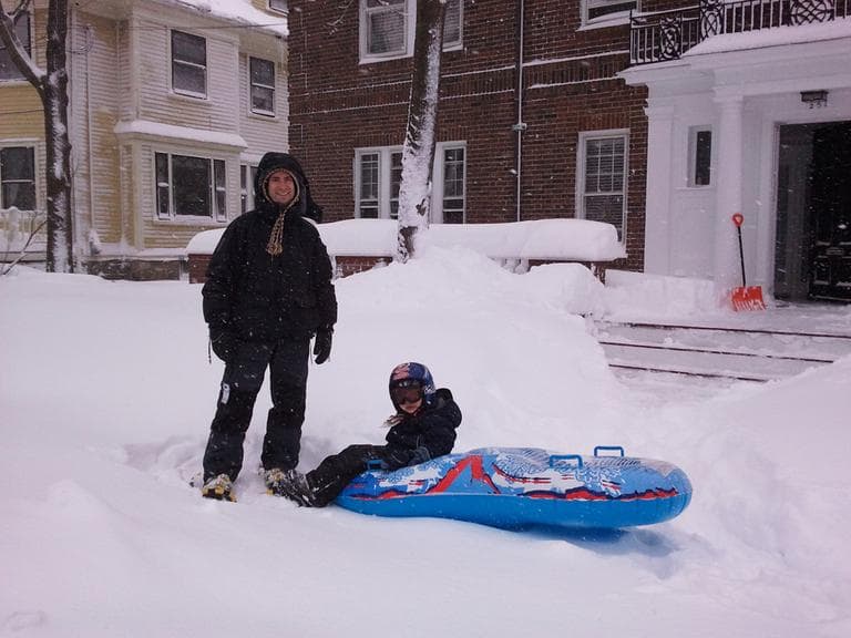 Paul Feldman and his son Zev in Brookline. (Aayesha Siddiqui/WBUR)