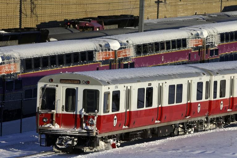 Massachusetts Bay Transportation Authority trains wait to start running again early Sunday, Feb. 10, 2013 in Boston. )Gene J. Puskar/AP)