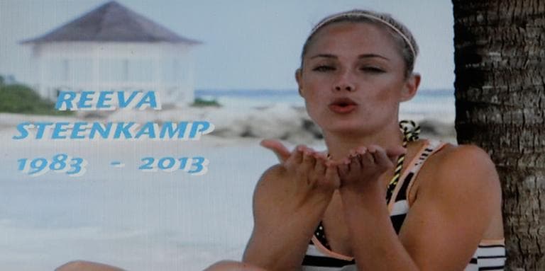 In this frame-grab from state television channel SABC 1 a tribute is devoted to slain model Reeva Steenkamp, girlfriend of Olympic athlete Oscar Pistorius. South Africa’s national broadcaster went ahead with the screening of the reality TV show "Tropica Island of Treasure" Saturday, Feb 16, 2013, featuring the dead model. Steenkamp encouraged her family to watch in one of her last conversations with them before her shooting death at the home of Pistorius. (Denis Farrell/AP)
