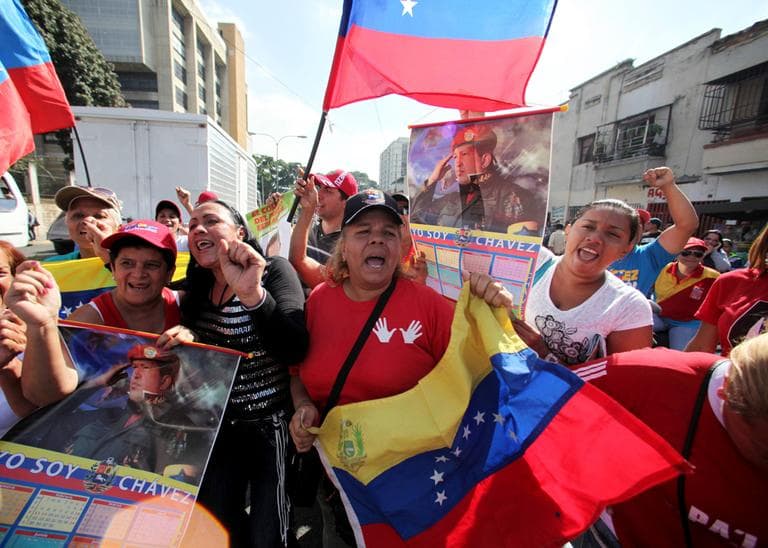 Supporters of Venezuela's President Hugo Chavez celebrate his return, outside the Carlos Arvelo Military Hospital in Caracas, Venezuela, Monday, Feb. 18, 2013. (Fernando Llano/AP)