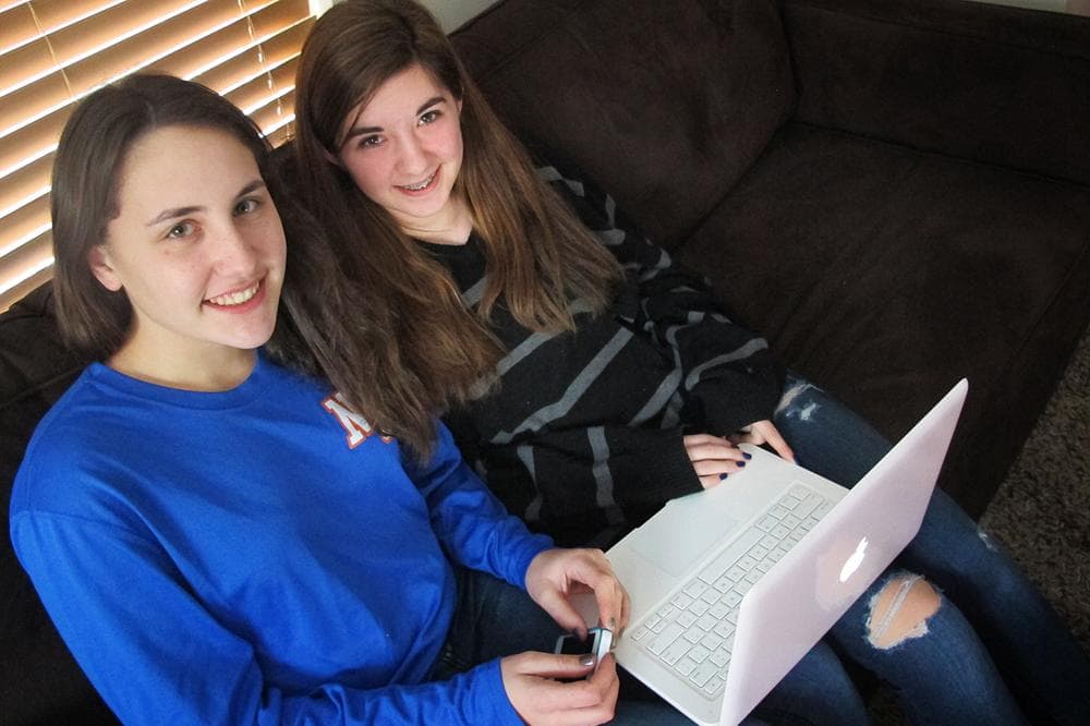 Newton South High School sophomores Chloe Miller and Paige Herer log on to Facebook 10 to 20 times a day. They say posting and "liking" profile pictures are a huge part of some teens’ social media experience. (Andrea Shea/WBUR)